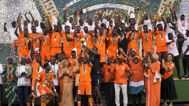 Ivory Coast 's Max-Alain Gradel lifts the trophy after winning the African Cup of Nations final soccer match between Nigeria and Ivory Coast, at the Olympic Stadium of Ebimpe in Abidjan, Ivory Coast, Sunday, Feb. 11, 2024. (AP Photo/Sunday Alamba)